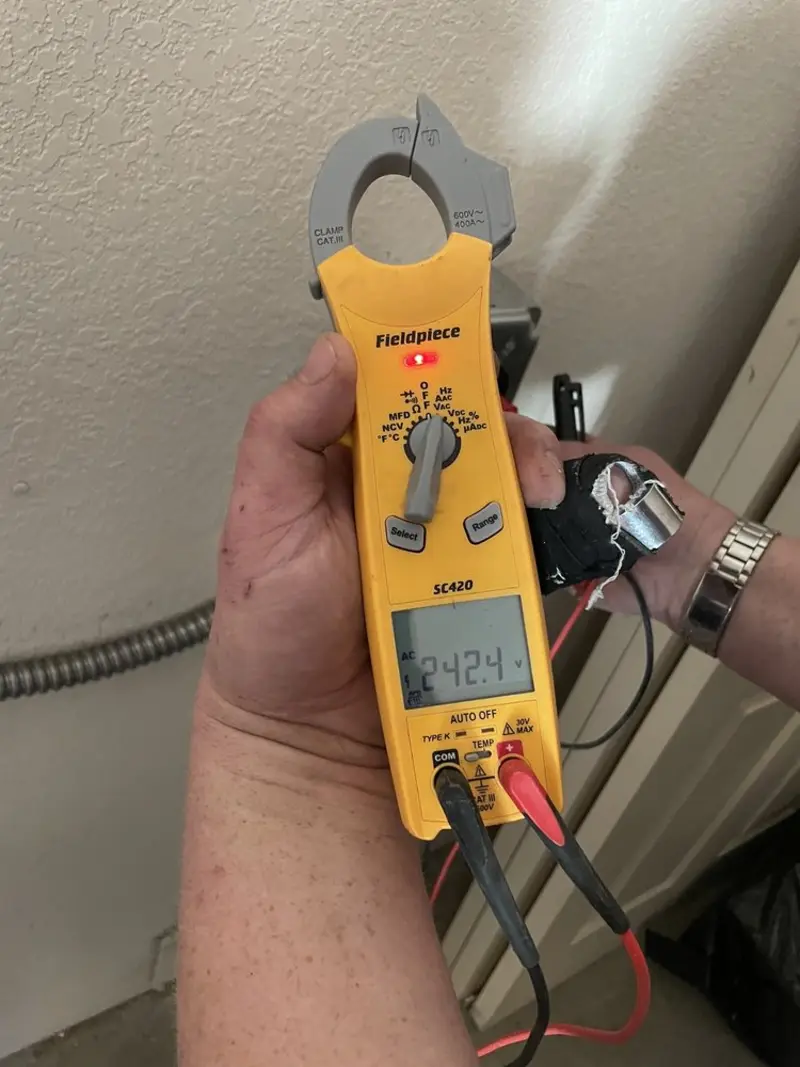 Voltage testing with clamp meter during Recessed Lighting Installation in Fayetteville